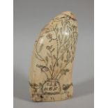 A 19thC scrimshaw, with punched decoration in the form of a tree, birds, and a flag bearing the