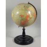 A late 19thC Philips 9inch terrestrial globe, on turned ebonised stand, 41cm high overall