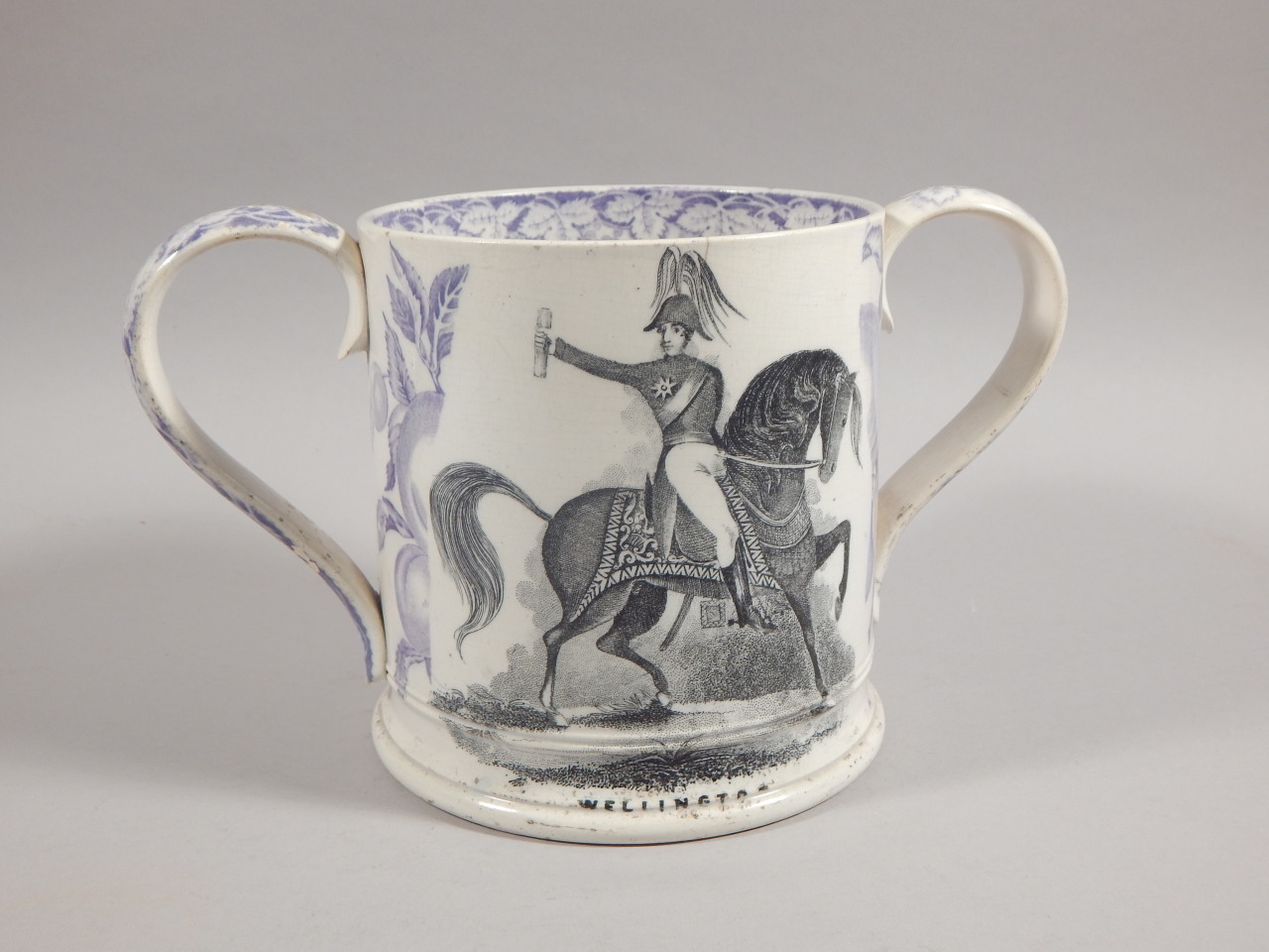 A mid 19thC Staffordshire frog mug, printed to one side with an image of The Duke of Wellington