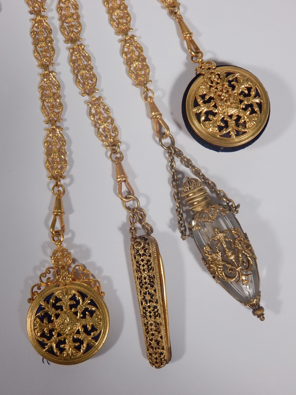 A late 19thC gilt metal chatelaine, elaborately cast in rococo style, the seven chains attached with - Image 4 of 4