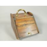 A Victorian walnut and brass coal scuttle, with liner.