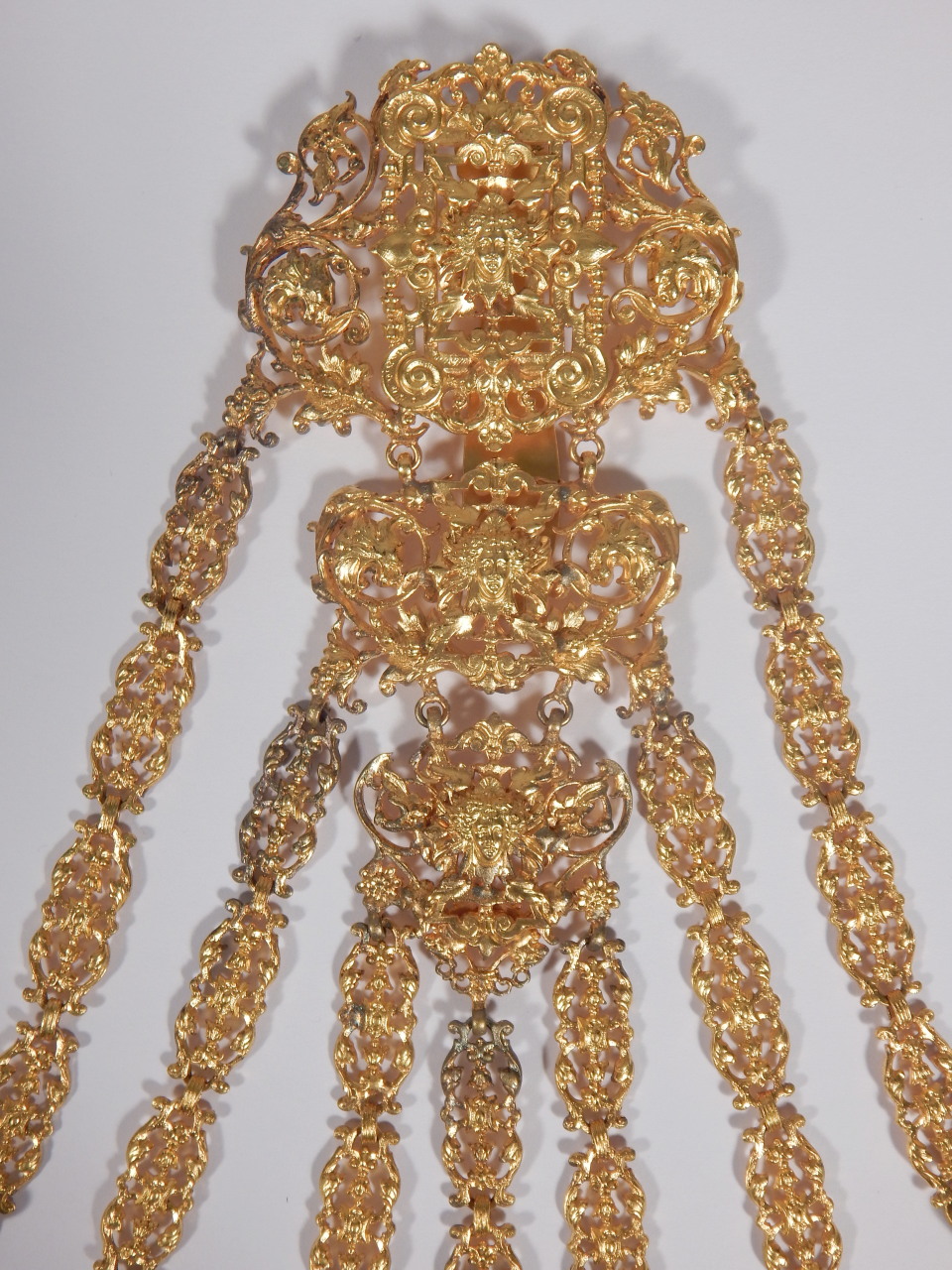 A late 19thC gilt metal chatelaine, elaborately cast in rococo style, the seven chains attached with - Image 2 of 4