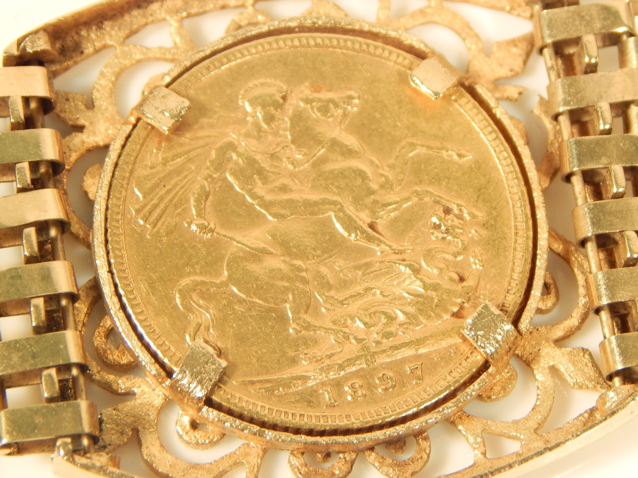 A triple sovereign bracelet, set with three full gold sovereigns, dated 1900, 1899, and 1897, with - Image 4 of 4