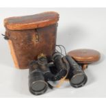 A set of ebonised Carl Zeiss binoculars, in leather case, stamped Geley & Sons Portsmouth, and a