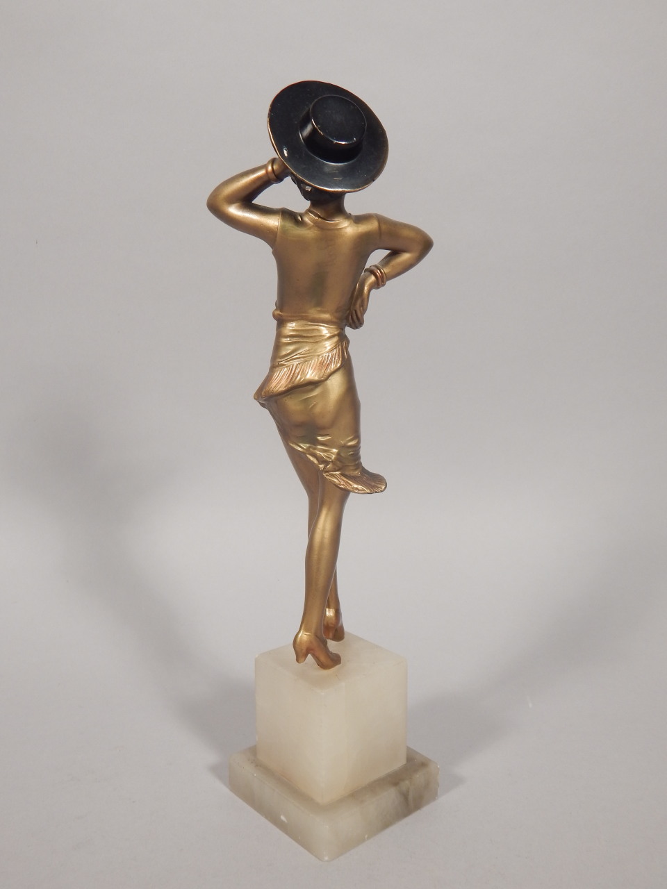 An Art Deco cold painted bronze figure of female dancer, wearing a Spanish style hat, on a stepped - Image 2 of 2