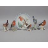 Five Goebel bird figures and a collector's plate, to include Robin, Wren, Blue tit and a Robin