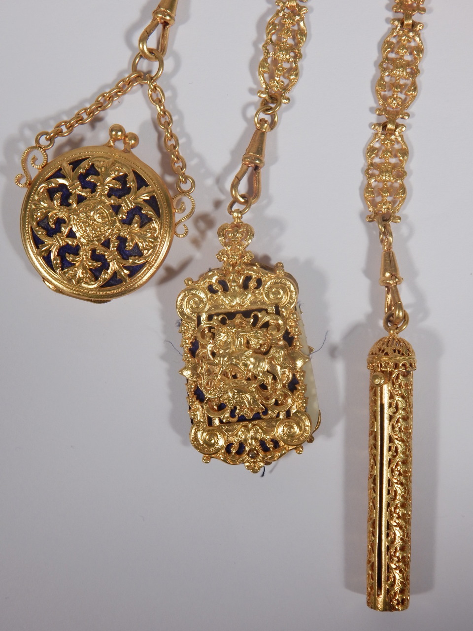 A late 19thC gilt metal chatelaine, elaborately cast in rococo style, the seven chains attached with - Image 3 of 4