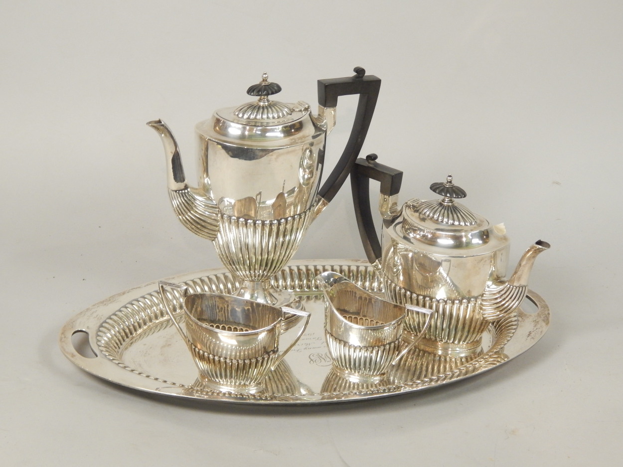 A Mappin & Webb silver four piece tea and coffee service with tray, with part fluted decoration, the