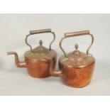 Two similar Victorian copper and brass kettles, each with an acorn style finial to the lid.