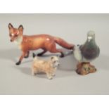Three Beswick animal ornaments, to include a large fox, large pigeon and a small dog