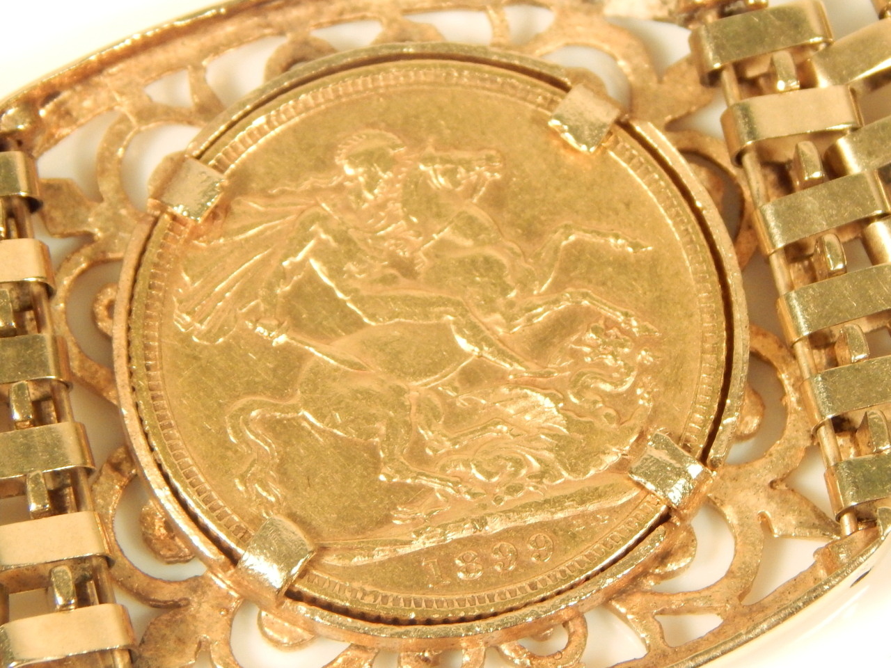 A triple sovereign bracelet, set with three full gold sovereigns, dated 1900, 1899, and 1897, with - Image 3 of 4