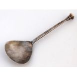 A George V silver Arts and Crafts spoon, by S Blanckensee & Sons Ltd, shaped bowl and curved handle,