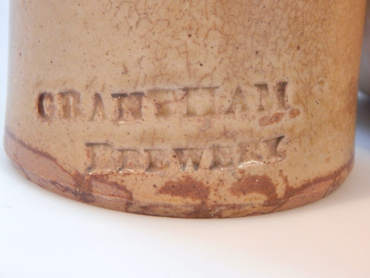 A Grantham brewery earthenware porter's style bottle, the cylindrical body with shouldered neck, - Image 2 of 2