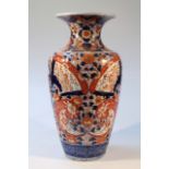 A 19thC Japanese Imari earthenware vase, floor standing with a squat trumpet stem and tapering