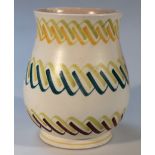 A Poole pottery vase, no. 718 the bellied body decorated with stripes in green, turquoise, orange