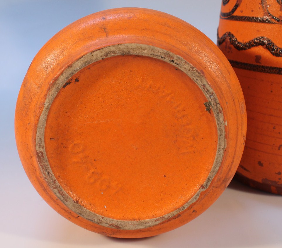 A pair of 1960's West German earthenware ewers, each circular body in orange with geometric - Image 2 of 2