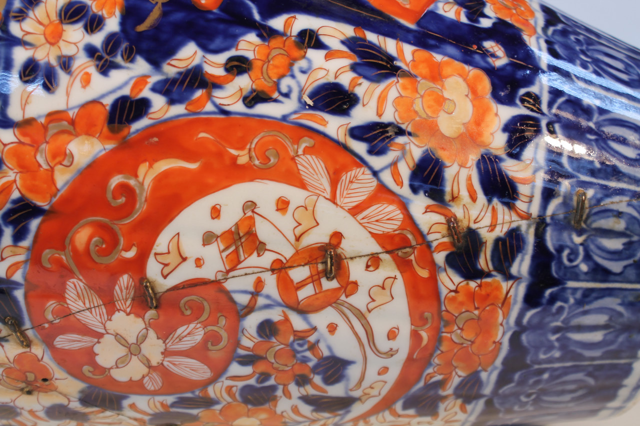 A 19thC Japanese Imari earthenware vase, floor standing with a squat trumpet stem and tapering - Image 5 of 5