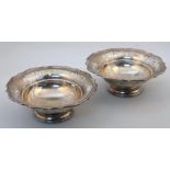 A pair of George VI Harrods silver bon bon dishes, each with a shaped part pierced outline on