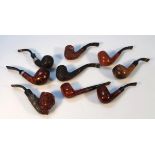 Various bygone pipes, to include one carved with a figure head of a gentleman wearing hat, 6cm high,