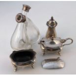 A Queen Elizabeth II silver cruet set, comprising open salt, lidded mustard jar and pepper pot,