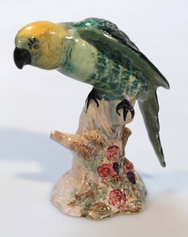 A Beswick figure, of a Parakeet no. 930 impressed marks beneath, 16cm high. (AF)