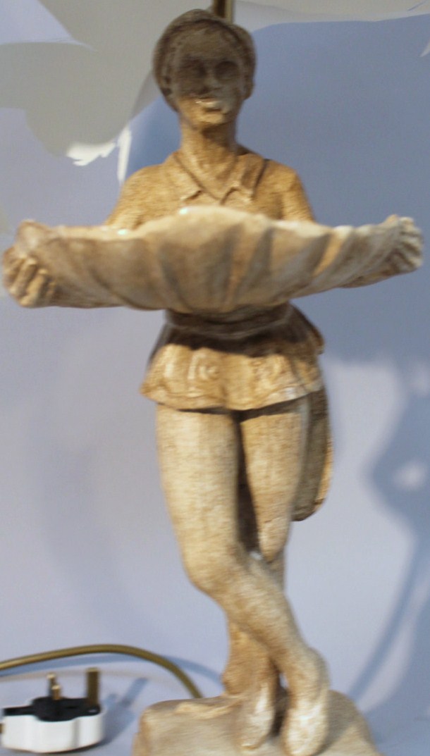 A resin table lamp, with white material shade on brass style column fronted by a figure holding a - Image 2 of 2