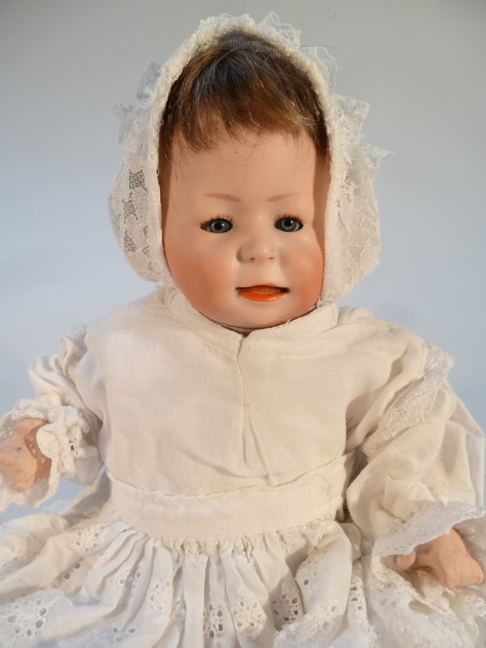 A 19thC German porcelain doll, of small proportion with blonde hair, blue sleep eyes and open mouth, - Image 2 of 4