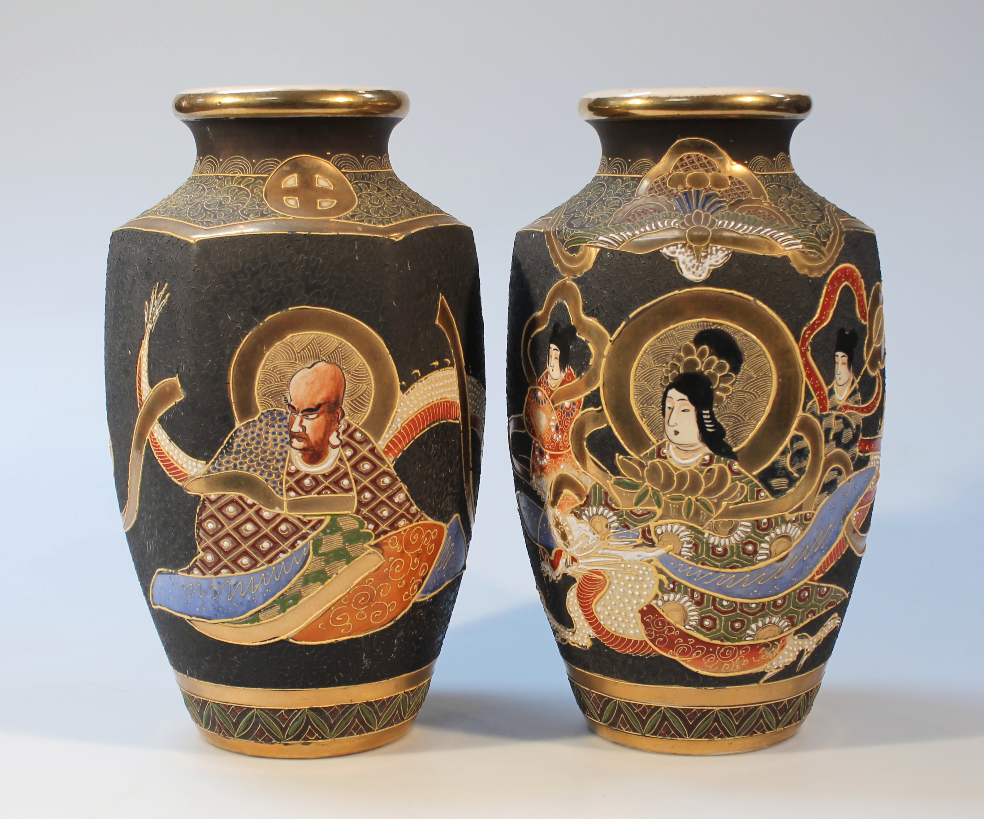 A pair of late 19thC Japanese satsuma pottery vases, each hexagonal body, hand painted and gilt