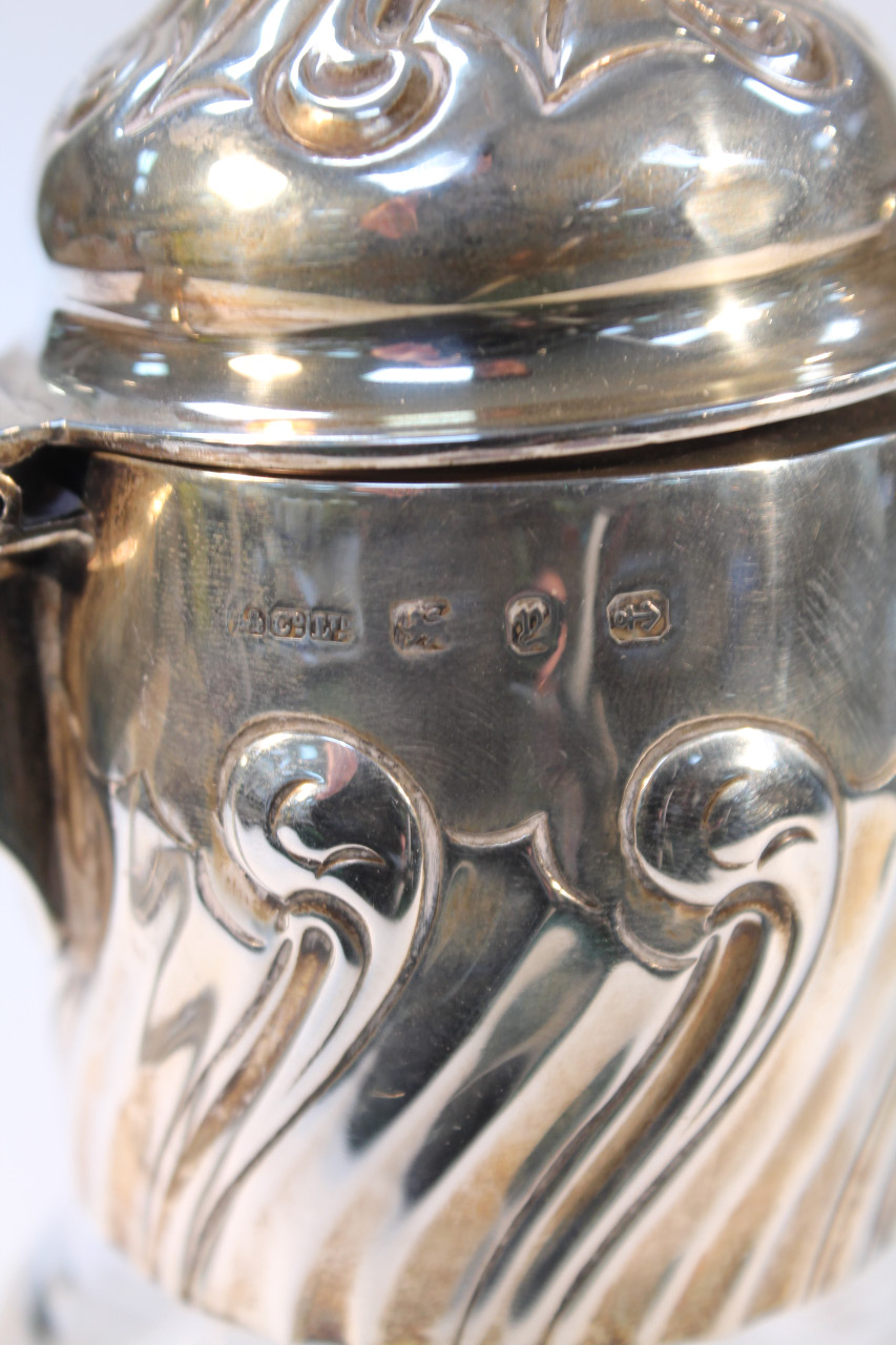 A Victorian silver and cut glass claret jug, with a floral domed lid headed by an acorn finial - Image 2 of 2