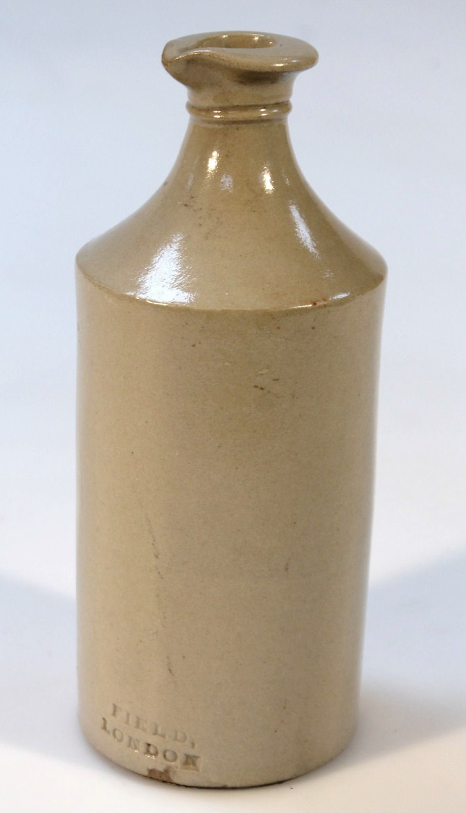 A late 19thC stoneware gin bottle, the plain shouldered body impressed Field London, 21cm high.