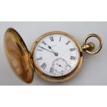 An 18ct gold gentleman's Hunter pocket watch, plain circular case and 4cm dia. enamel dial with