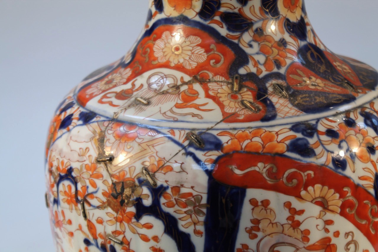 A 19thC Japanese Imari earthenware vase, floor standing with a squat trumpet stem and tapering - Image 3 of 5