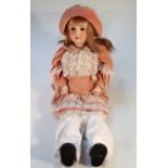A late 19thC German Viola bisque headed doll, with blonde hair, blink eyes, open mouth showing