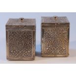 A pair of late 19thC/early 20thC Indian tea canisters, each square body heavily decorated with