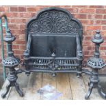 A 20thC cast iron small fire grate, the back decorated with figures, with gothic style finials, 48cm