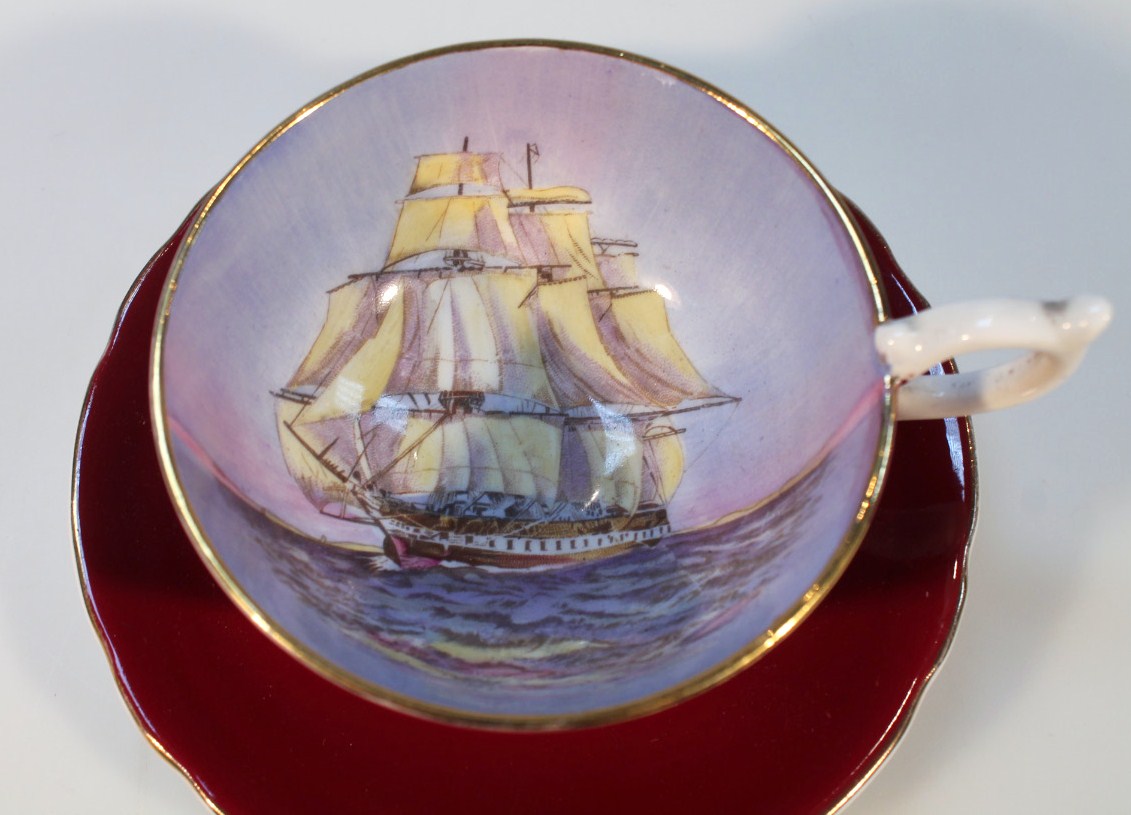 An Aynsley shipping cup and saucer, mainly decorated in brown with gilt highlights, printed marks - Image 2 of 3