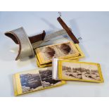 An early 20thC stereoscopic viewer, with metal mounts and a quantity of various viewing cards, to