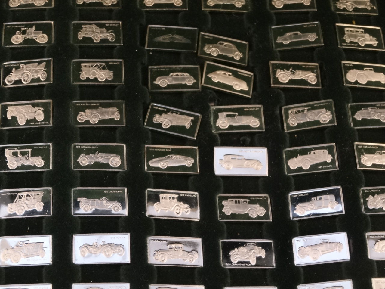 A John Pinches 100 Greatest car silver miniature ingot collection, in pressed green case, 27cm wide, - Image 2 of 3