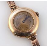 A ladies cocktail watch, the circular 2cm dia. dial with Arabic numerals fitted in a case, marked