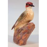 A Royal Worcester matt finish figure, of a woodpecker, no. 3249, printed marks beneath, 19cm high.