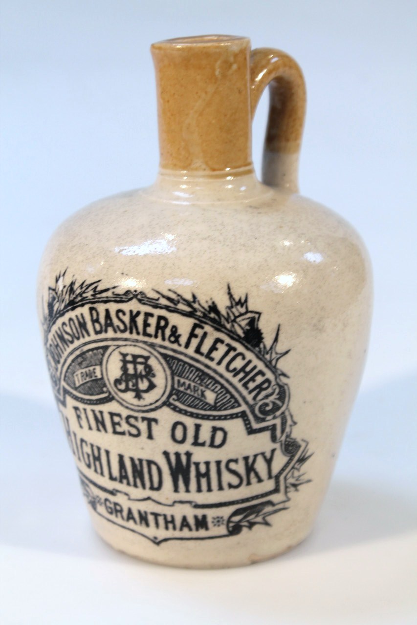 A Johnson Basker & Fletcher Grantham Finest Old Highland whisky stoneware flagon, in two colours