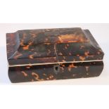 A 19thC tortoiseshell casket, the rectangular domed top centred by a vacant cartouche hinging to