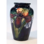 A mid-20thC Moorcroft Orchid pattern vase, decorated with flowers on blue ground, impressed and