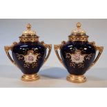 A pair of early 20thC Coalport porcelain vases, each circular shouldered body decorated with