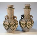 A pair of Japanese Nippon porcelain vases, each with shouldered stems flanked by moulded butterfly