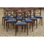 A set of nine Georgian style mahogany dining chairs, with crossbanded X frame backs and drop in