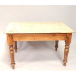 A Victorian pine kitchen table, with turned legs and drawer with dummy drawer to verso, 120cm wide.