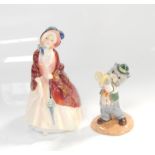A Royal Doulton lady figure, entitled Paisley Shaw HN1988, with a Beswick tom cat figure.