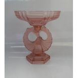 An Art Deco pressed glass cake stand, of angelic form, 29cm high.