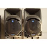 A pair of Mackie SRM 450 active sound reinforcement monitor system top speakers, with matching